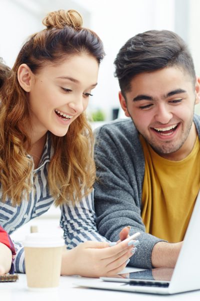 Happy learners video chatting with friends online